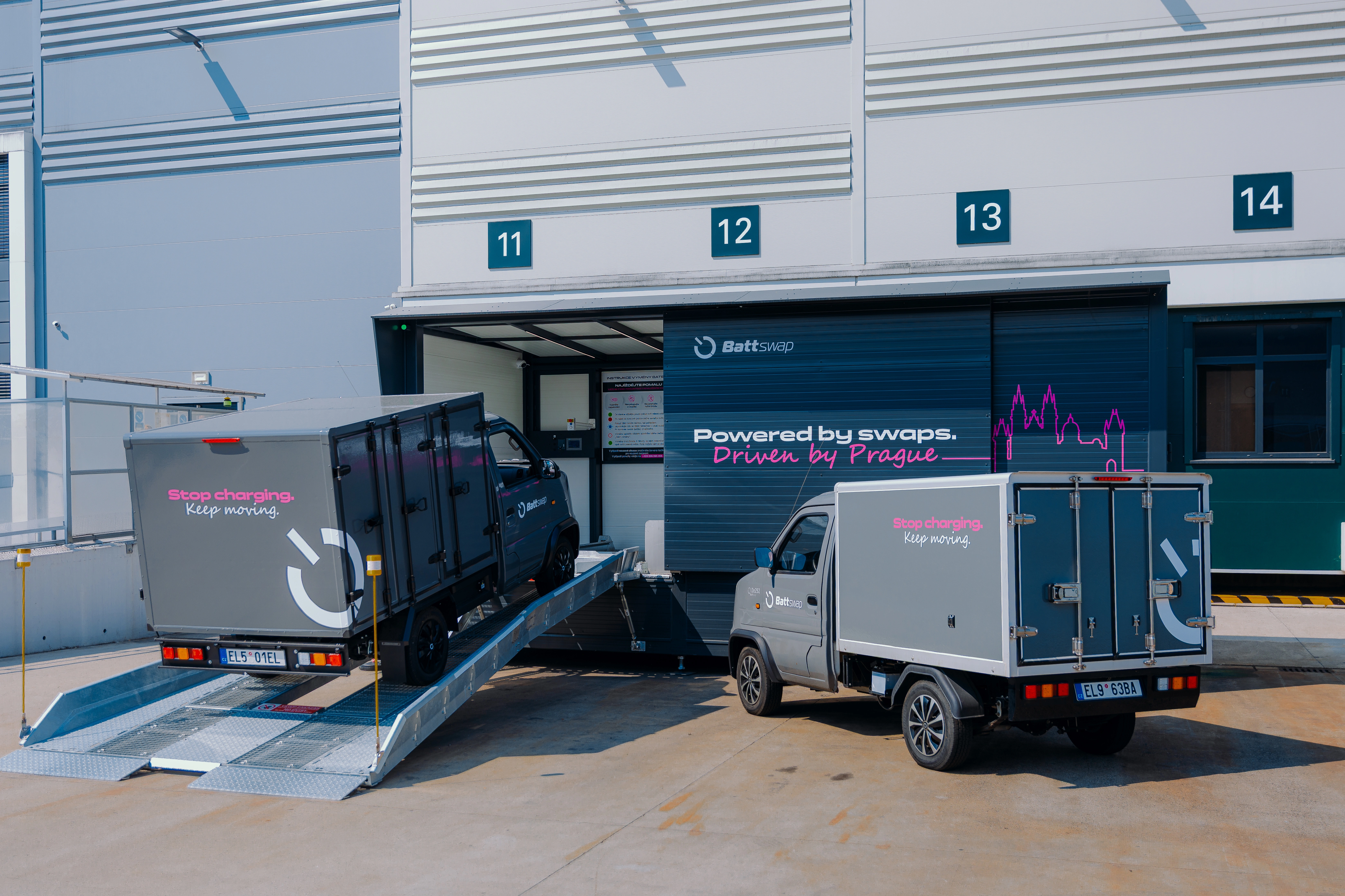 A Battswap van driving up the ramp into a swap station while a second van waits beside it